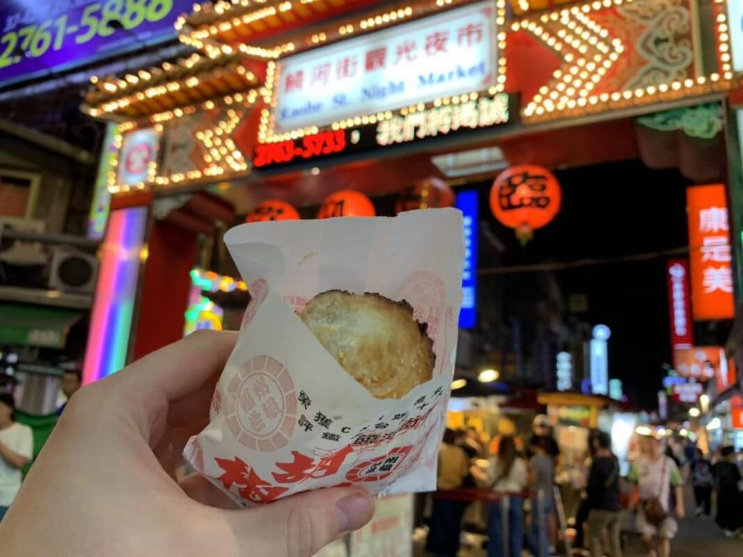 Enjoying a Hu Jiao Bing at Raohe Night Market